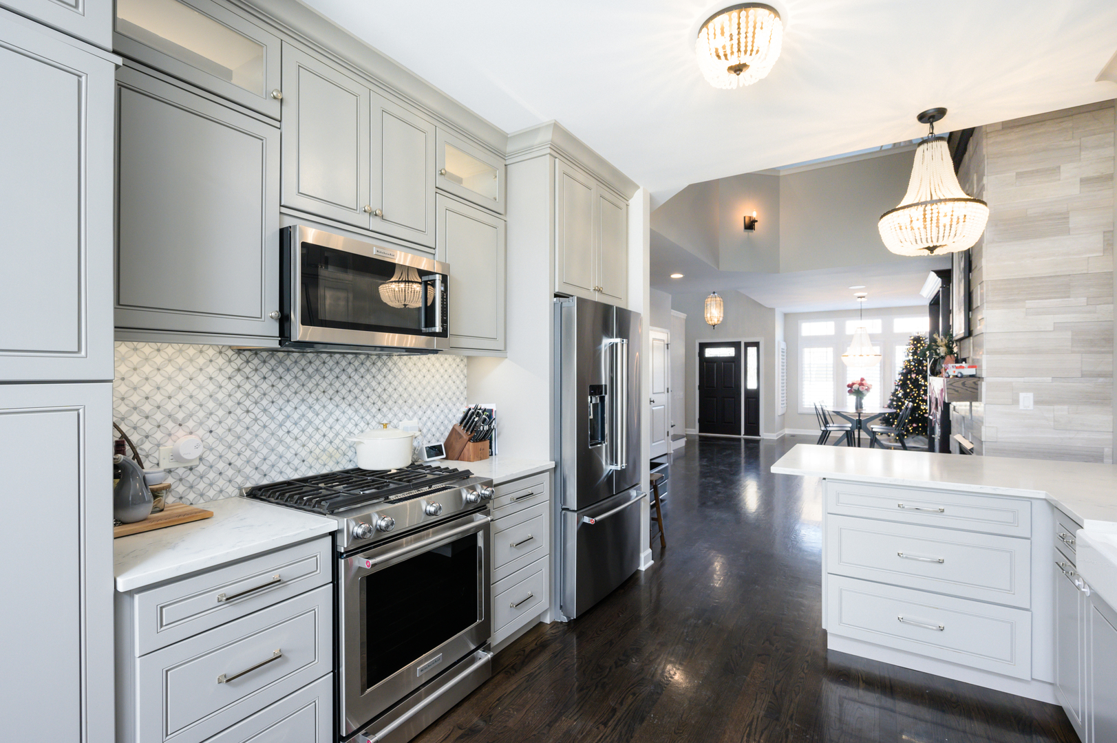232 North Addison Avenue Elmhurst, IL 60126 - Photo 7 of 28 a kitchen with stainless steel appliances kitchen island granite countertop a stove a sink and a microwave