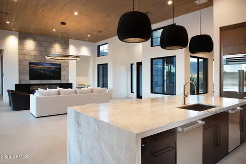 a kitchen with stainless steel appliances a microwave a stove and refrigerator