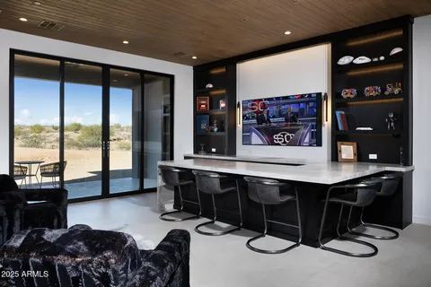 a living room with furniture a rug and a large window