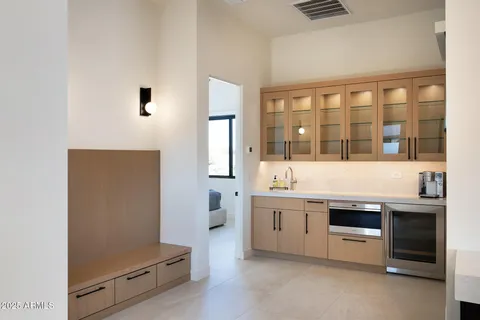a kitchen with stainless steel appliances a stove and cabinets
