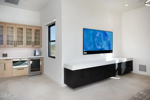 a bedroom with a bed and ceiling fan