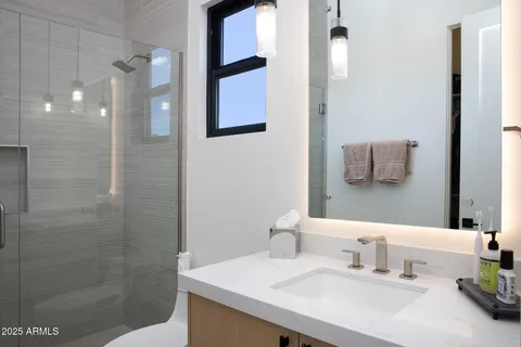 a bedroom with a bed and a cabinets