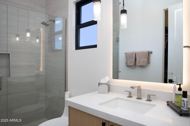 a bedroom with a bed and a cabinets