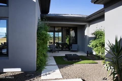 a front view of a house with garden