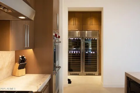a kitchen with granite countertop a stove and a microwave
