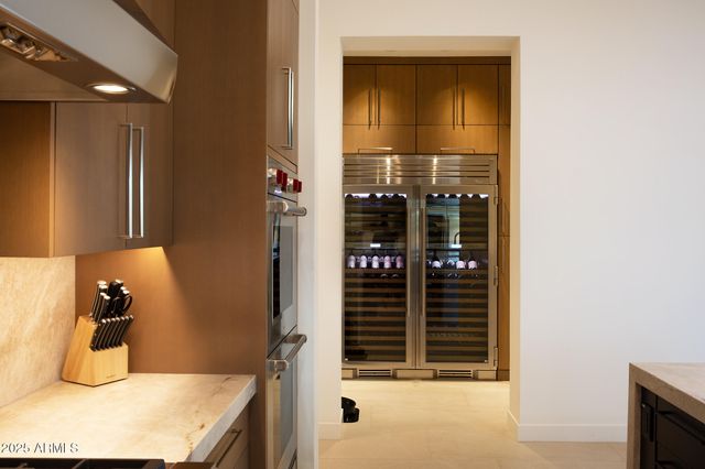 a kitchen with granite countertop a stove and a microwave