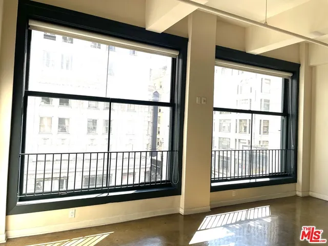 a view of a room with a large window