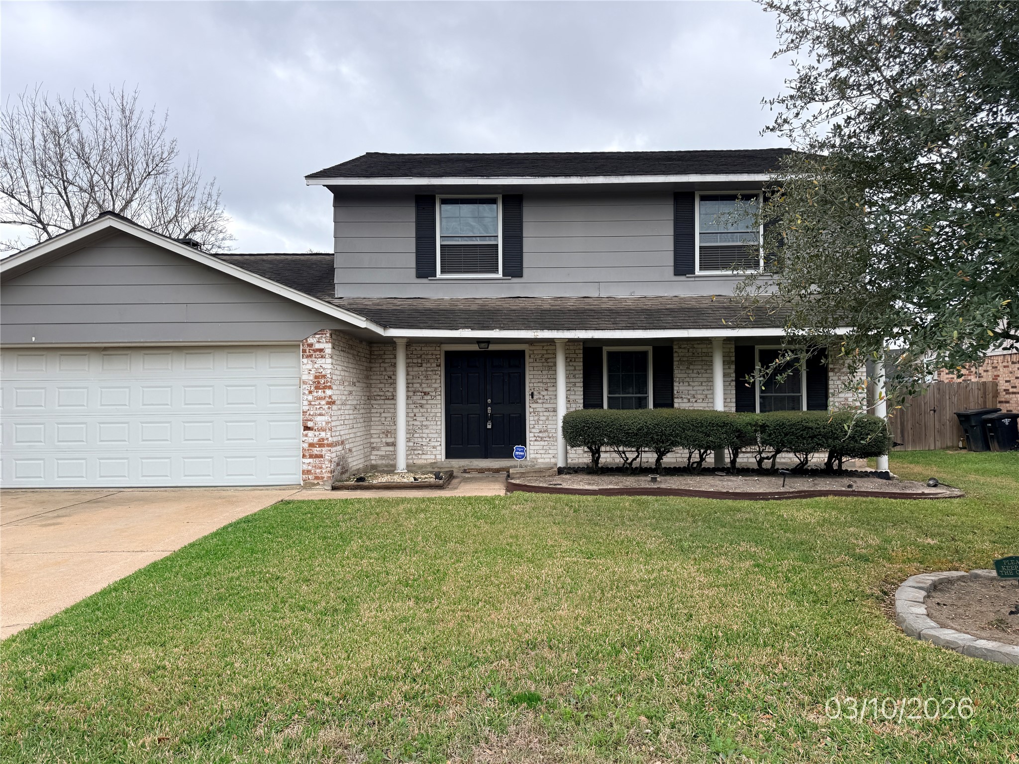 2018 Westlake Way Houston, TX 77084 - Photo 1 of 14 a front view of a house with a yard and garage