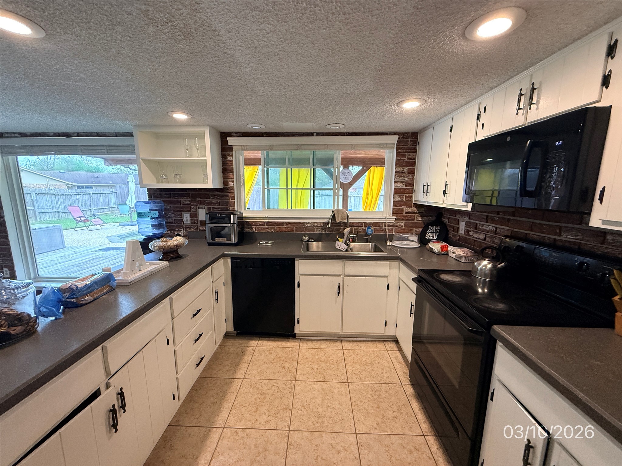 2018 Westlake Way Houston, TX 77084 - Photo 2 of 14 a kitchen with stainless steel appliances granite countertop a sink a stove a microwave a counter top space and cabinets