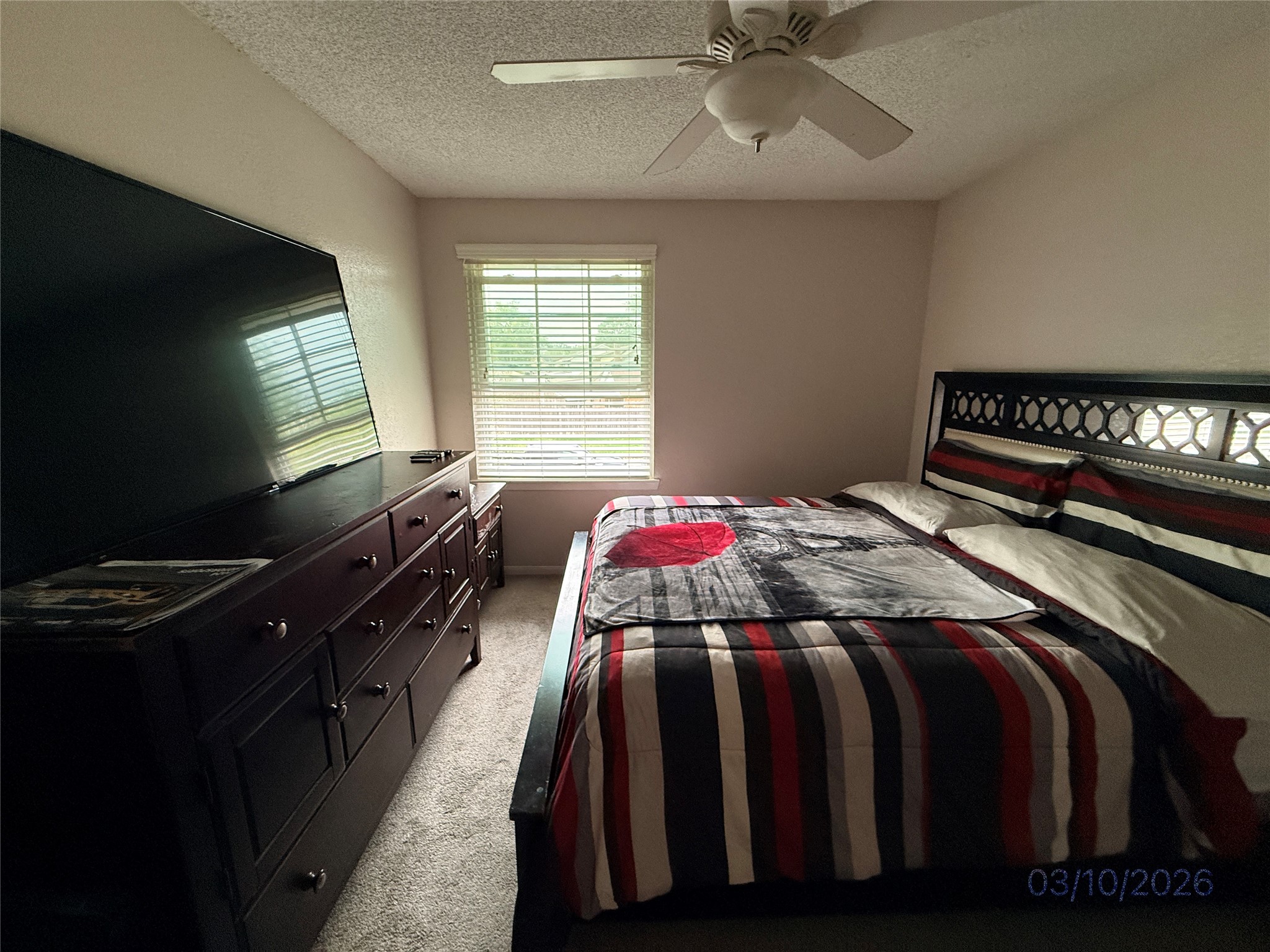 2018 Westlake Way Houston, TX 77084 - Photo 8 of 14 a bedroom with a bed and a flat screen tv