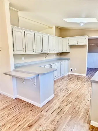a kitchen with a sink and a window