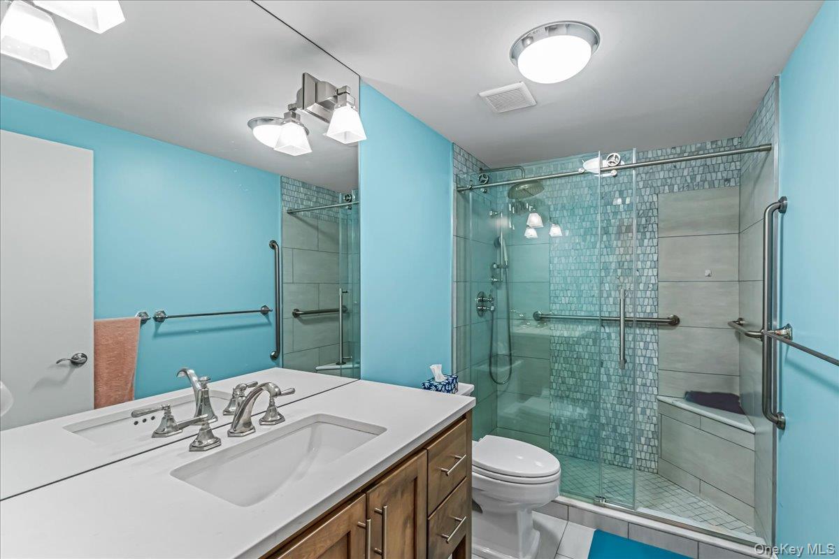 400 East 70th Street, Unit 201 Manhattan, NY 10021 - Photo 12 of 21 a bathroom with a sink toilet and shower