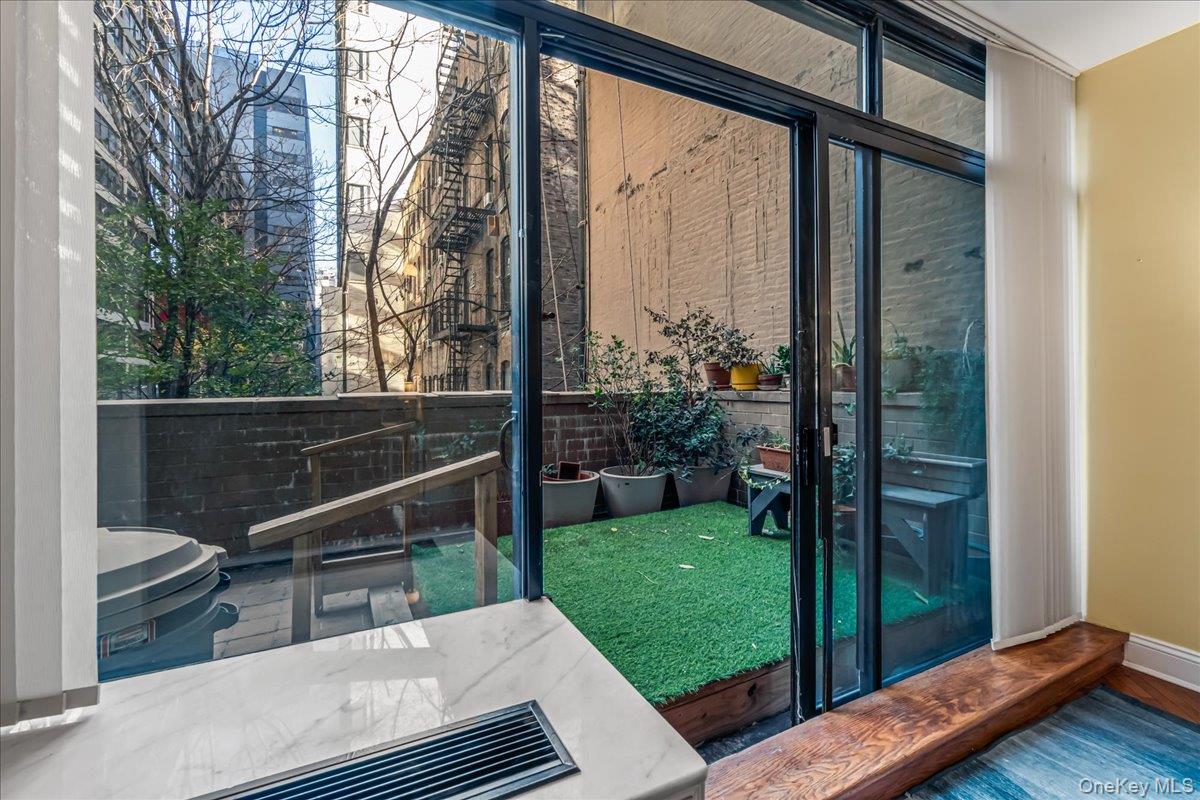 400 East 70th Street, Unit 201 Manhattan, NY 10021 - Photo 14 of 21 a view of outdoor space yard and patio