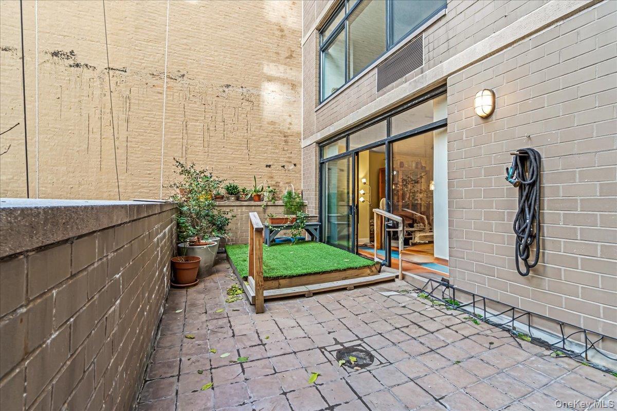 400 East 70th Street, Unit 201 Manhattan, NY 10021 - Photo 15 of 21 a bathroom with a granite countertop sink and a mirror
