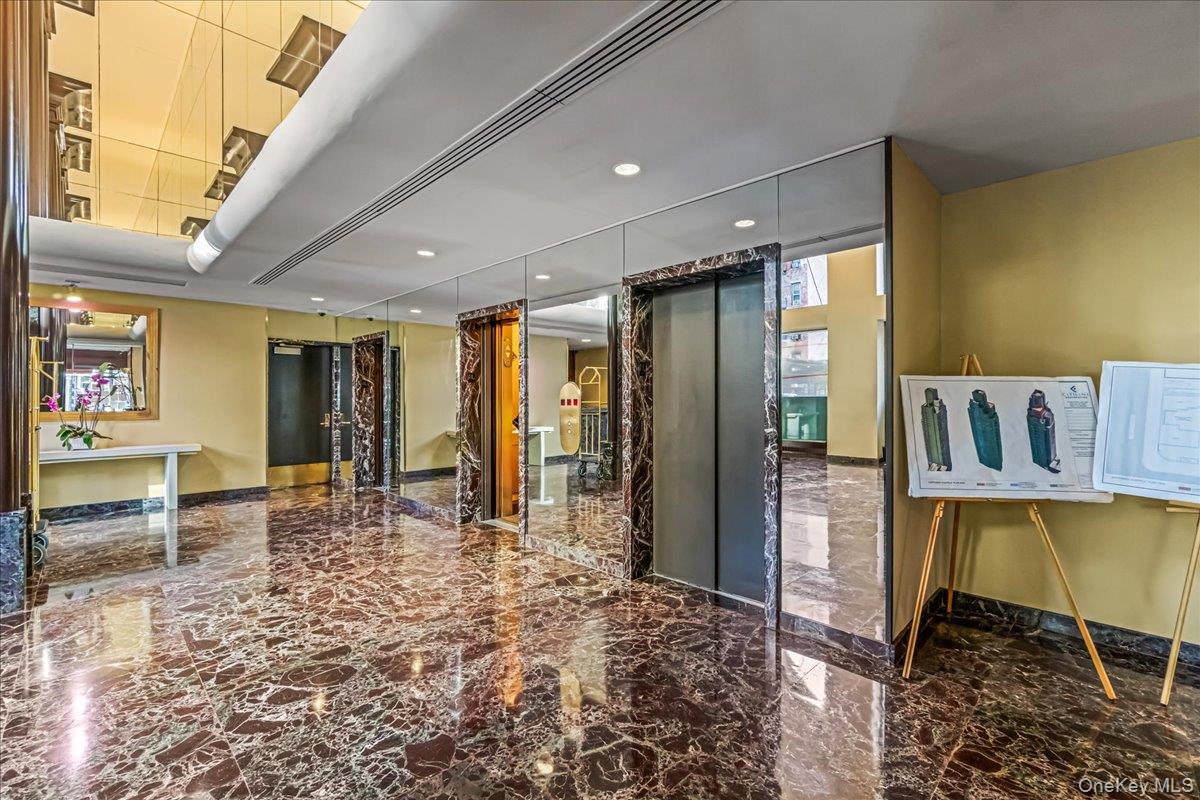 400 East 70th Street, Unit 201 Manhattan, NY 10021 - Photo 19 of 21 a very nice looking room with a large window