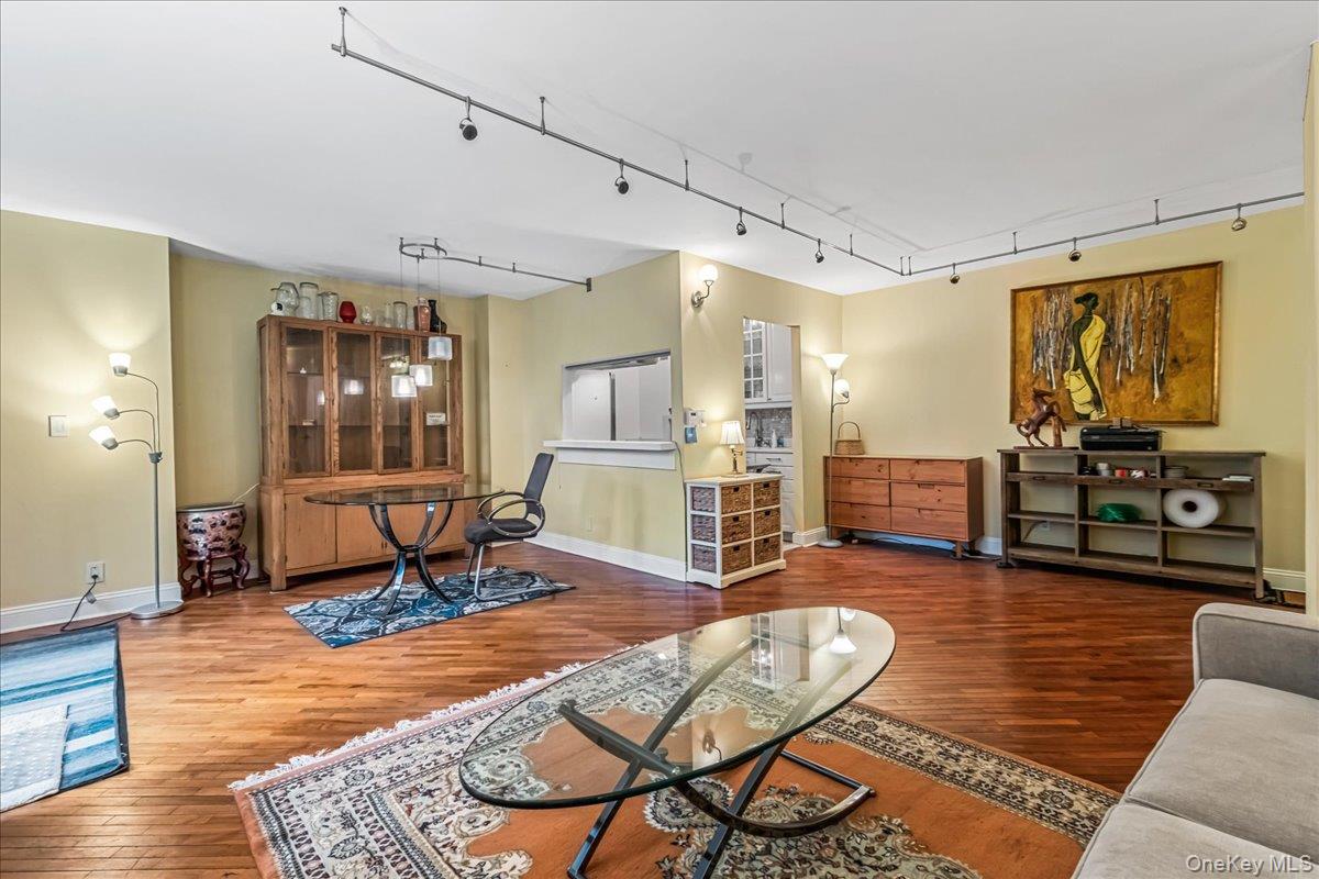 400 East 70th Street, Unit 201 Manhattan, NY 10021 - Photo 3 of 21 a living room with furniture and wooden floor