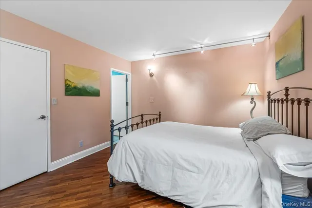 a bedroom with a bed and a mirror