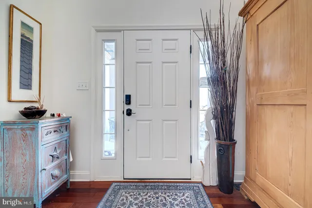 a view of a closet area with mirror