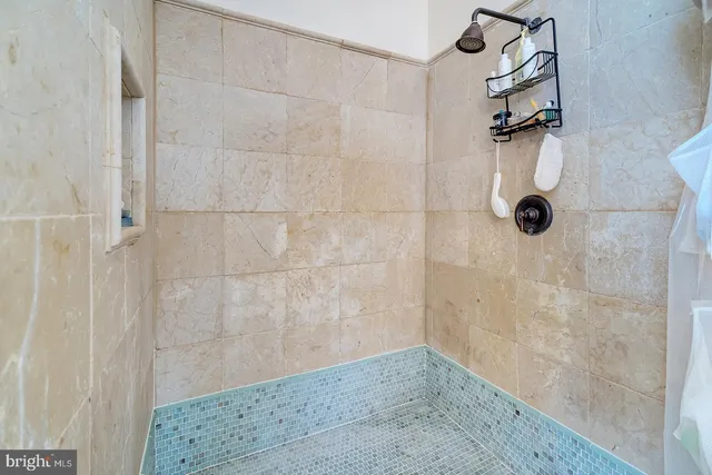 a spacious bedroom with a bed and a couch