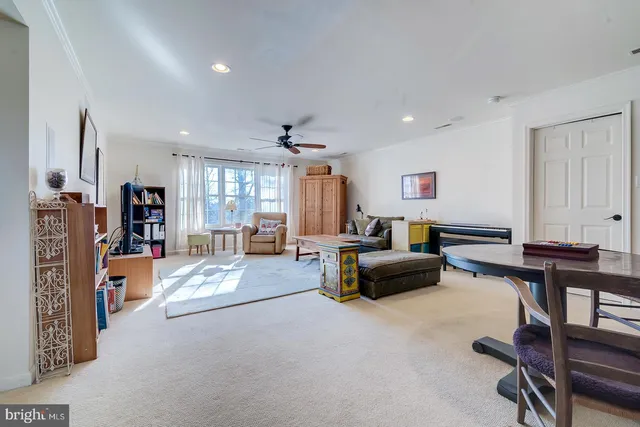 a bedroom with furniture and a book shelf