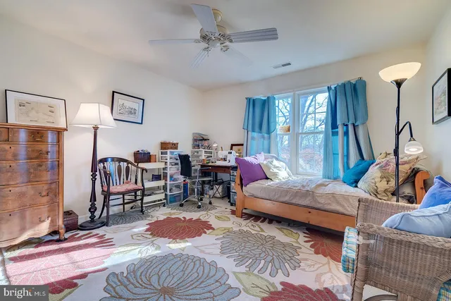 a bathroom with a sink vanity and mirror