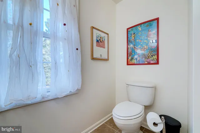 a bedroom with a bed and a night stand