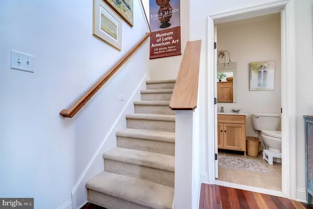 a bathroom with a toilet a sink and a mirror