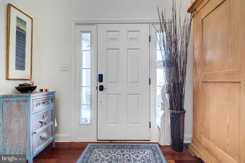 a kitchen with stainless steel appliances kitchen island granite countertop a sink and cabinets