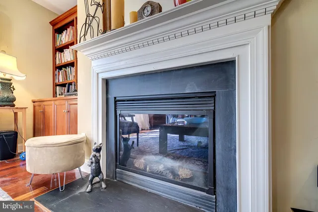 a bathroom with a toilet a mirror and a shower