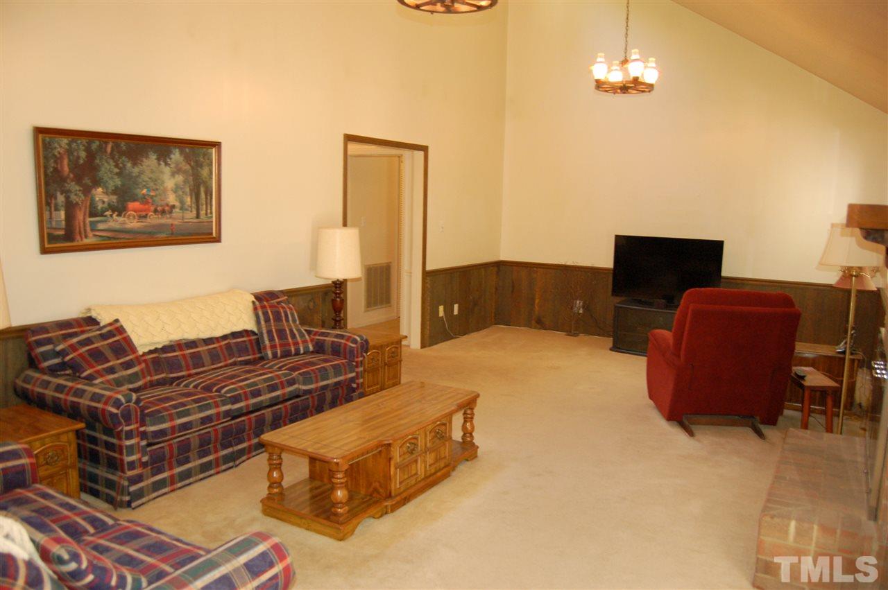 804 Valetta Road Durham, NC 27712 - Photo 13 of 28 a bedroom with a bed and wooden floor