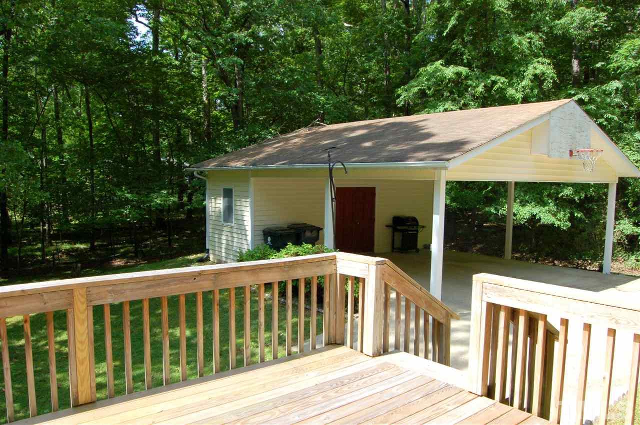 804 Valetta Road Durham, NC 27712 - Photo 3 of 28 a view of a wooden deck and a yard with big trees