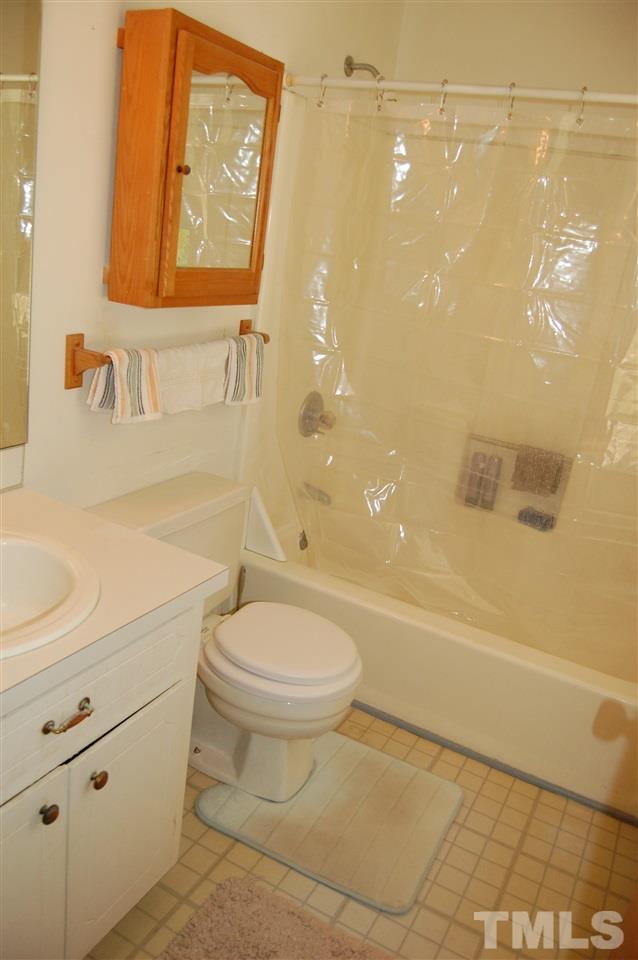 804 Valetta Road Durham, NC 27712 - Photo 27 of 28 a bathroom with a toilet sink and shower