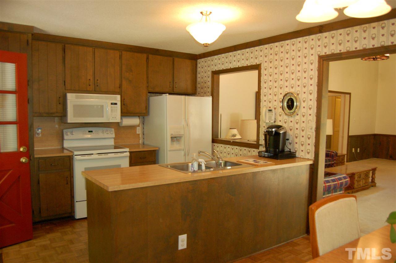 804 Valetta Road Durham, NC 27712 - Photo 7 of 28 a kitchen with appliances a sink and cabinets