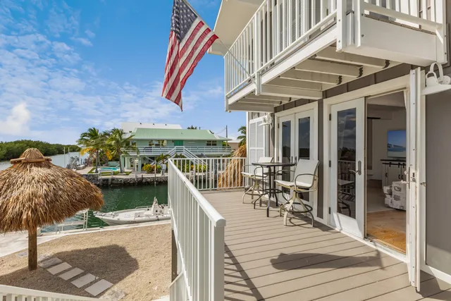 a view of a swimming pool with outdoor seating