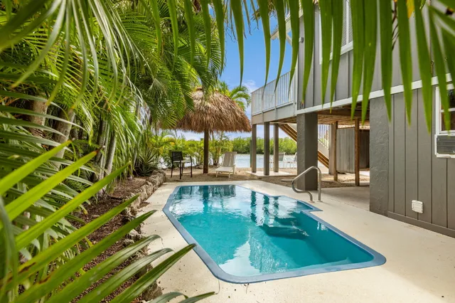 a view of a swimming pool with a patio