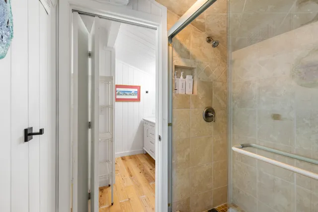 a bathroom with a shower and a sink