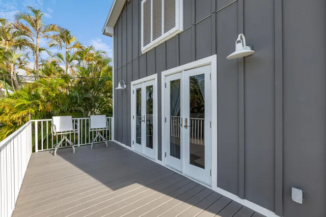 a view of a balcony with wooden floor