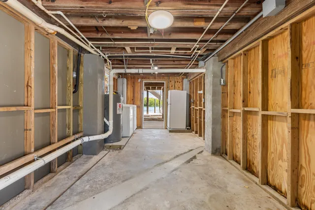 a view of an empty room with wooden walls