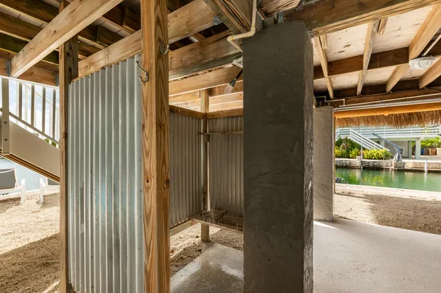 a view of a hallway with wooden floors