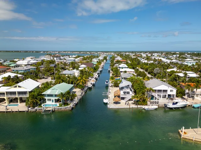 a swimming pool with outdoor seating and yard