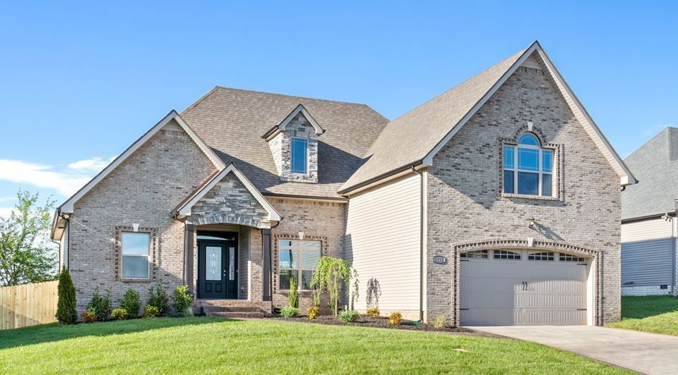 54 Memory Lane Adams, TN 37010 - Photo 1 of 1 a front view of a house with a garden and plants