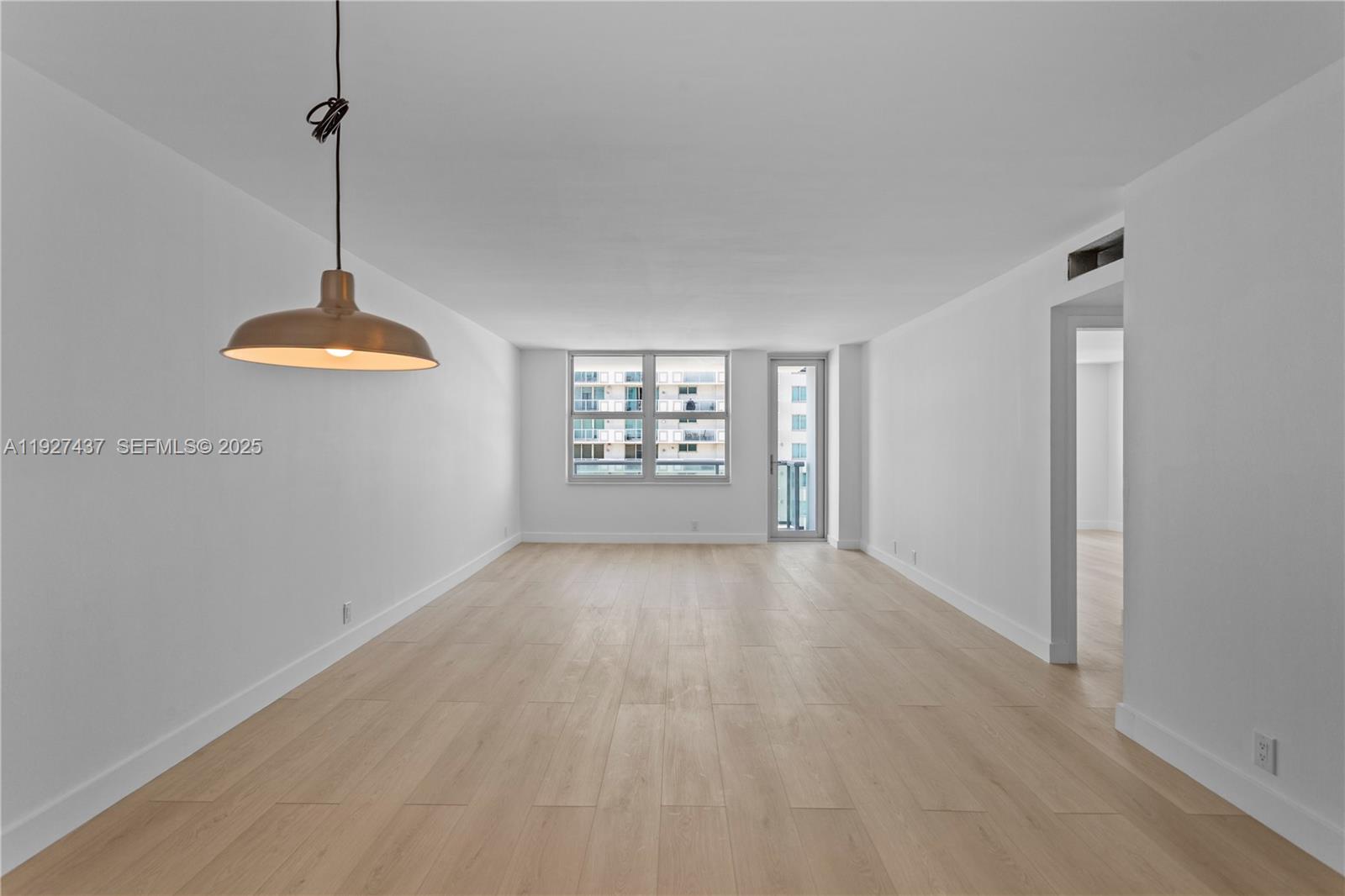 9511 Collins Avenue, Unit 806 Surfside, FL 33154 - Photo 11 of 32 a view of an empty room with a window