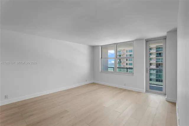 a view of an empty room with a window