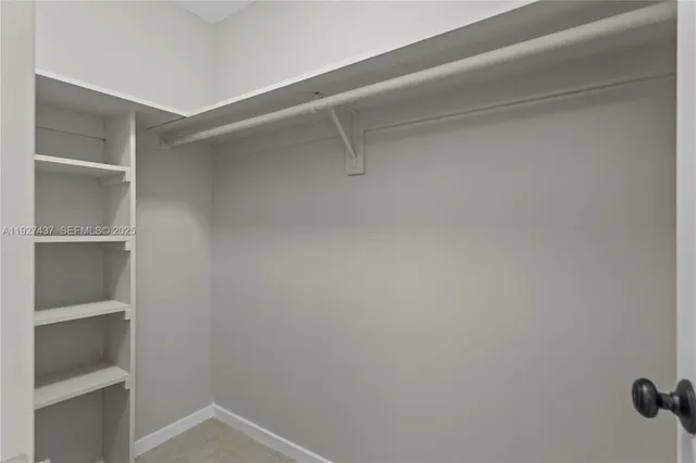 a view of an empty walk in closet