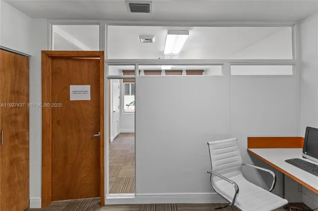 a bathroom with a window and a shower