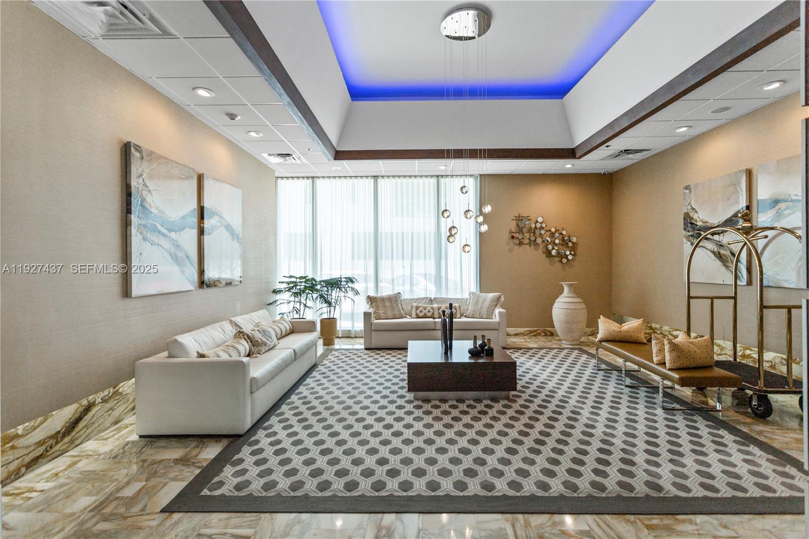 9511 Collins Avenue, Unit 806 Surfside, FL 33154 - Photo 31 of 32 a living room with furniture