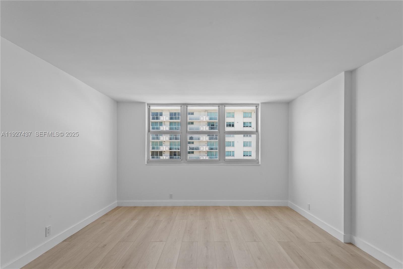 9511 Collins Avenue, Unit 806 Surfside, FL 33154 - Photo 8 of 32 a view of an empty room with a window