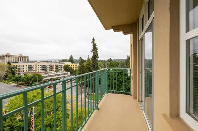 a view of a balcony with city view