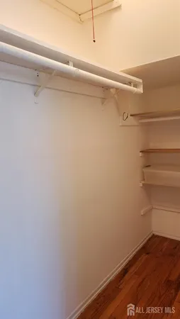 a view of a room with racks on the wall