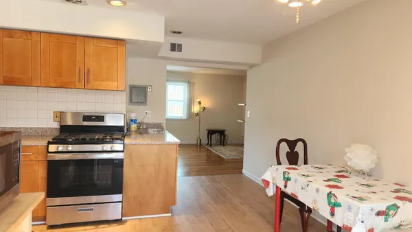a kitchen with a stove a sink and a refrigerator